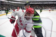 Carolina Hurricanes left wing Jordan Martinook (48) and Dallas Stars center Mavrik Bourque,...