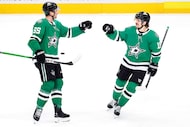 Dallas Stars defenseman Thomas Harley (55) congratulates center Sam Steel (18) on his second...