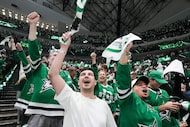 Dallas Stars fans celebrate a goal by Stars center Tyler Seguin during the first period in...