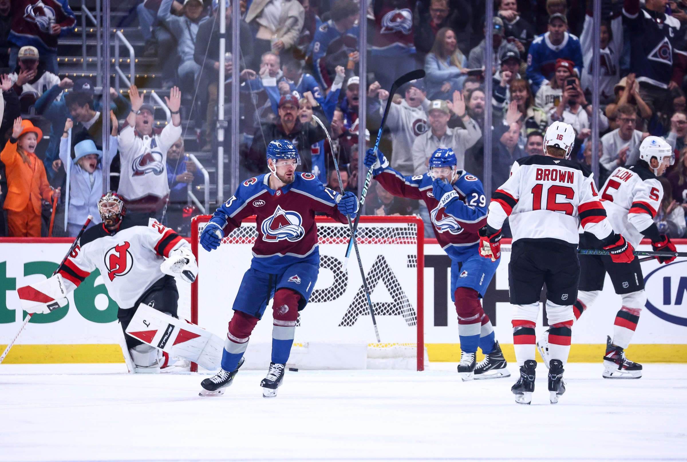 DENVER, COLORADO - OCTOBER 28: Valeri Nichushkin #13 and Nathan MacKinnon #29 celebrate a goal by Martin Necas #88 of the Colorado Avalanche against the New Jersey Devils in the first period at Ball Arena on October 28, 2025 in Denver, Colorado. (Photo by Tyler Schank/Clarkson Creative/Getty Images)