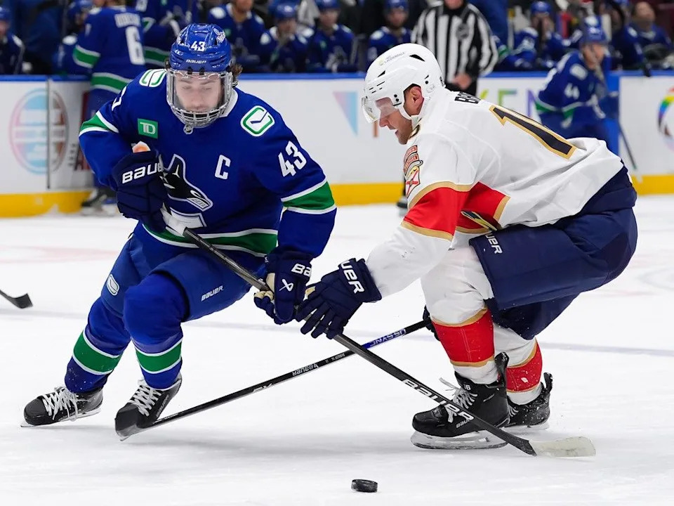  Fleet-footed Quinn Hughes wheels around Aleksander of the Panthers on Dec. 12, 2004 at Rogers Arena.