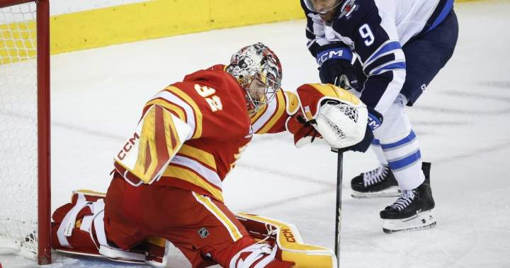 Scheifele scores late as Jets burn Flames 2-1