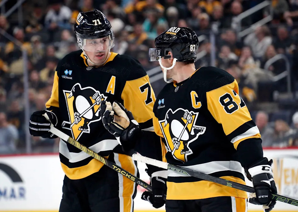 Pittsburgh Penguins center Evgeni Malkin (71) listens to center Sidney Crosby (87).Charles LeClaire-USA TODAY Sports
