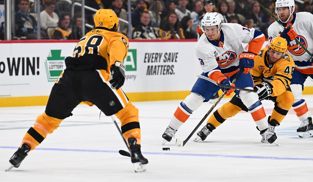 Mathew Barzal #13 of the New York Islanders skates with the puck in the second period of the game against the Pittsburgh Penguins at PPG PAINTS Arena on October 9, 2025 in Pittsburgh, Pennsylvania