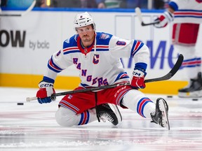 J.T. Miller of the New York Rangers stretches prior to playing against his former team at Rogers Arena in Vancouver on October 28, 2025.