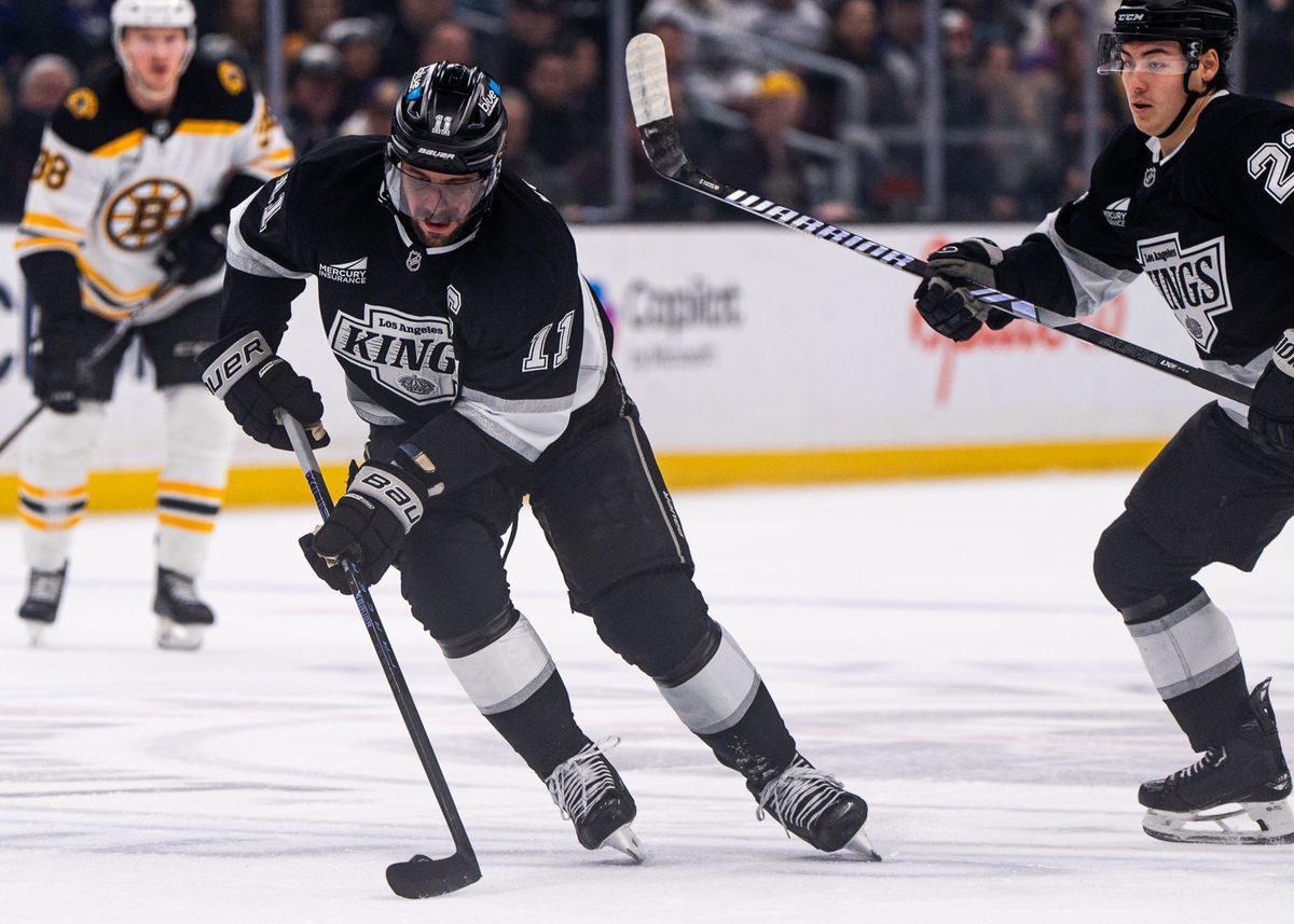 Los Angeles Kings Center, Anze Kopitar, 11, fighting through defense during an NHL hockey game against the Bruins on March 23, 2025 in Los Angeles, CA. Los Angeles Kings Center, Anze Kopitar, 11, fighting through defense during an NHL hockey game against the Bruins on March 23, 2025 in Los Angeles, CA.