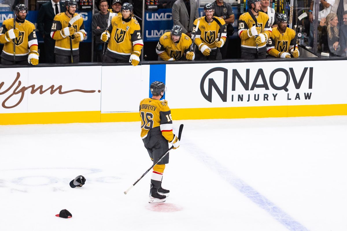 Vegas Golden Knights right-winger Pavel Dorofeyev (16) looks at the bench as fans throw hats onto the ice after Dorofeyev scores a hattrick during a NHL game between the Vegas Golden Knights and the Los Angeles Kings, Wednesday October 8, 2025 in Las Vegas, Nev.