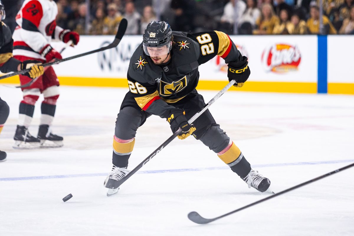 Vegas Golden Knights right-wing Alexander Holtz (26) skates the puck into the offensive-zone during a NHL game between the Vegas Golden Knights and the Carolina Hurricanes, Monday October 20, 2025 in Las Vegas, Nev.