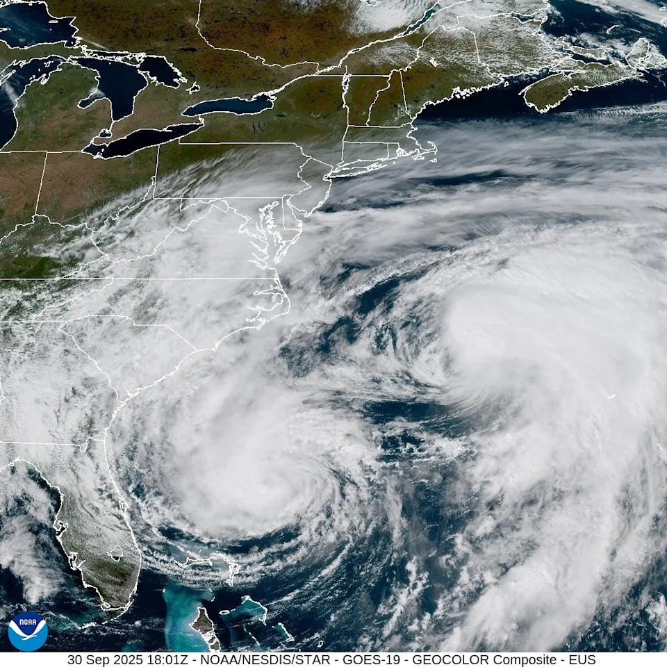 Hurricanes Imelda and Humberto swirl in the Atlantic Ocean on Sept. 30, 2025 in this image from NOAA's GOES 19 satellite.