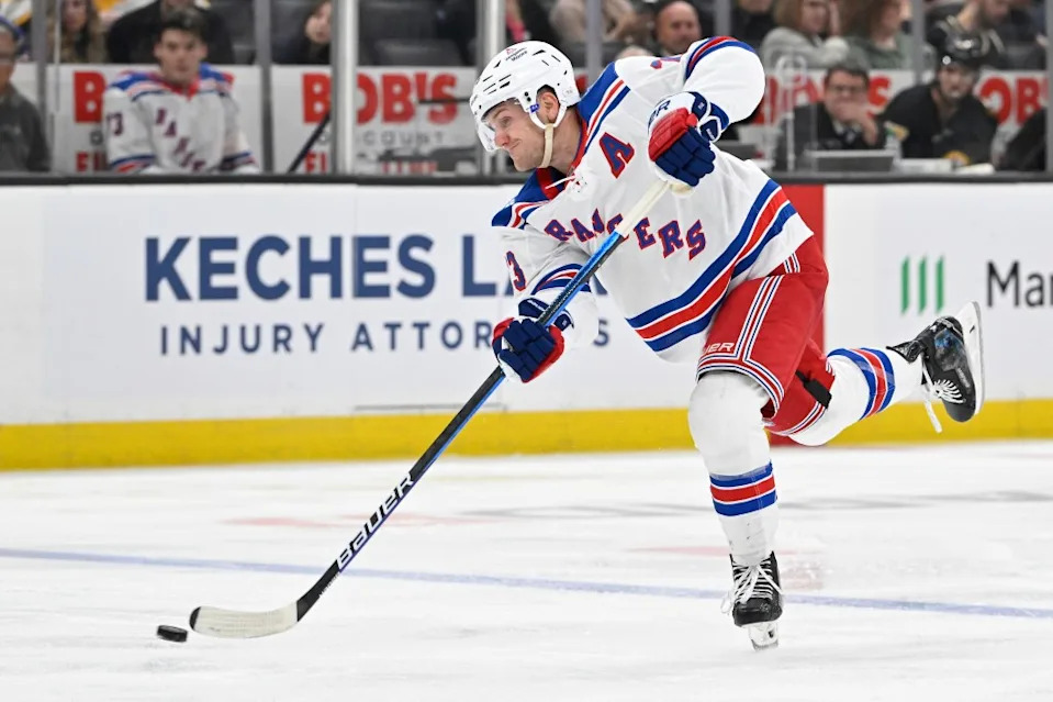 Rangers defenseman Adam Fox (23) shoots the puck against the Boston Bruins during the second period at TD Garden. Eric Canha-Imagn Images