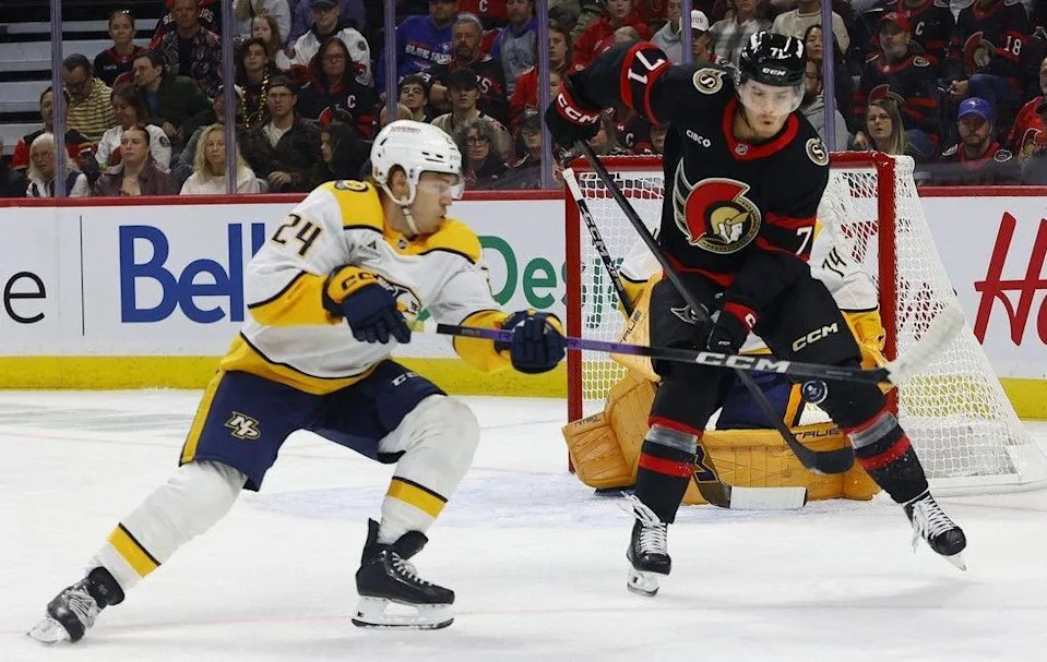  Ridly Greig of the Ottawa Senators tries to tip the puck past Nashville Predators goalie Juuse Saros during first-period action at the Canadian Tire Centre in Ottawa Monday.