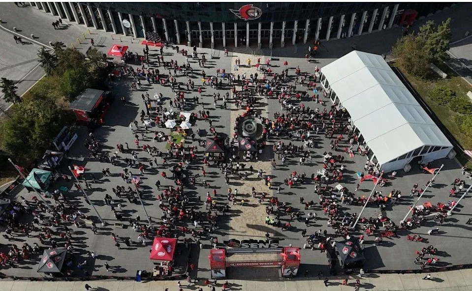  Sens fans enjoying the nice weather outside the Canadian Tire Centre before the home opener Monday.