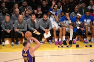 Dallas Mavericks head coach Jason Kidd, second from left, watches as Los Angeles Lakers...