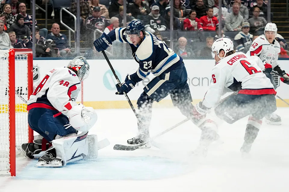 Columbus Blue Jackets center Sean Monahan (23) shoots at Washington Capitals goaltender Logan Thompson (48)during the first period of the NHL hockey game at Nationwide Arena in Columbus on Oct. 24, 2025.