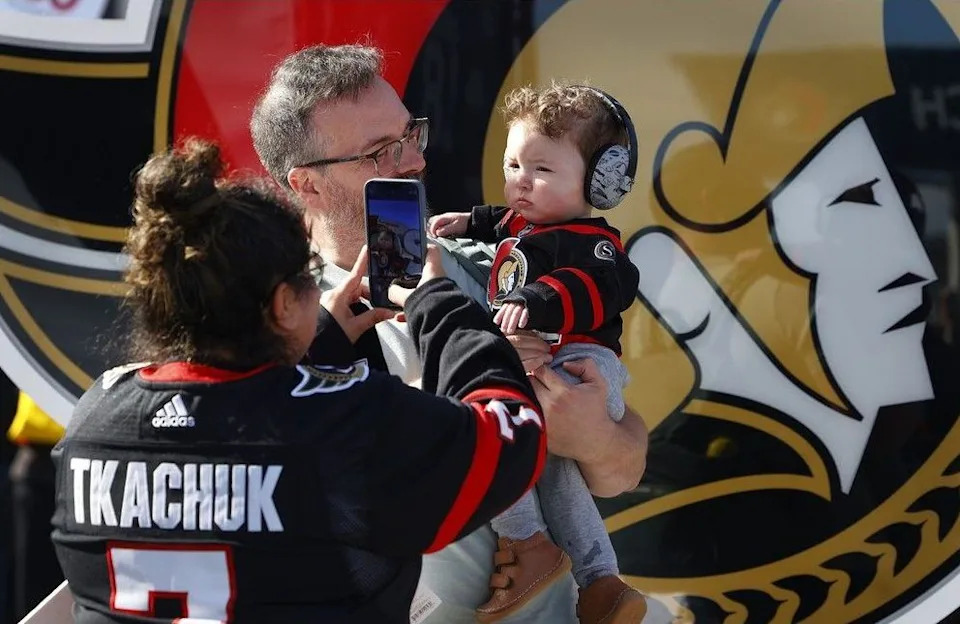  Sens fans enjoying the nice weather outside the Canadian Tire Centre before the home opener Monday.