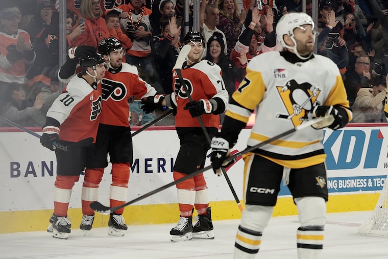 Flyers # 10 Bobby Brink, # 27 Noah Cates, and # 71 Tyson Forester after Brink scored to tie the game 1-1 in the first period of the Pittsburgh Penguins at Philadelphia Flyers NHL game at Xfinity Mobile Arena in Philadelphia on Tuesday, October 28, 2025.