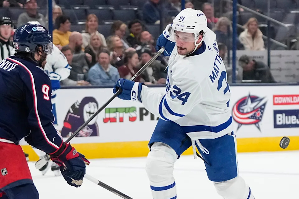 Oct 22, 2024; Columbus, Ohio, USA; Columbus Blue Jackets defenseman Ivan Provorov (9) pokes away a shot from Toronto Maple Leafs center Auston Matthews (34) during the second period of the NHL hockey game at Nationwide Arena.