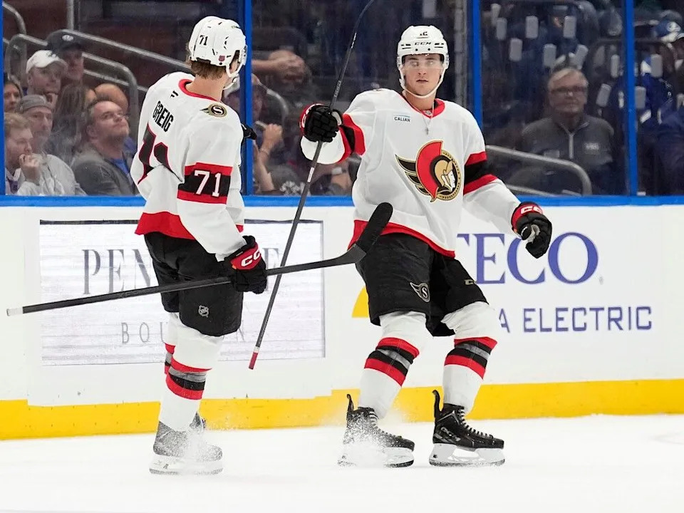  Senators forwards Ridly Greig, left, and Shane Pinto celebrate Pinto’s goal in the second period of Thursday’s game against the Lightning.
