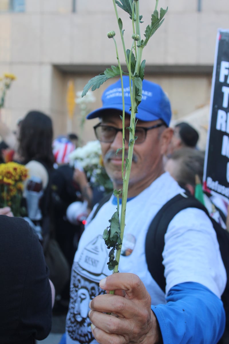 Protestors holding flowers