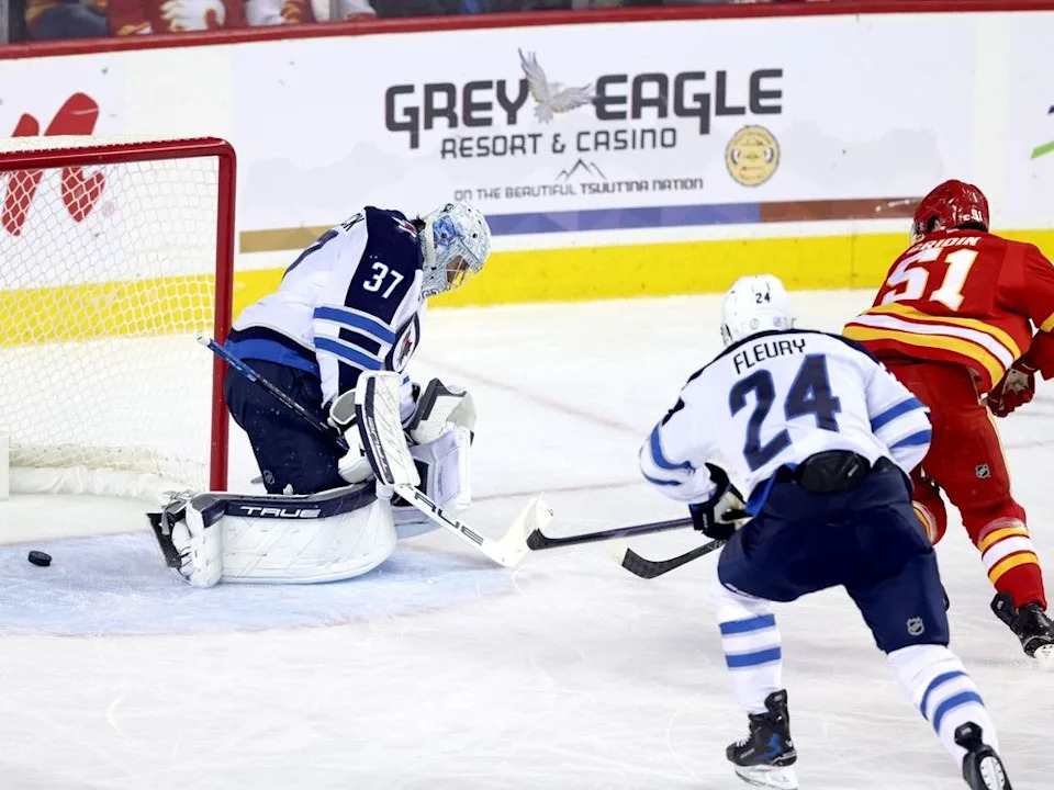 Matvei Gridin puts the puck past Jets goaltender Connor Hellebuyck on Friday.