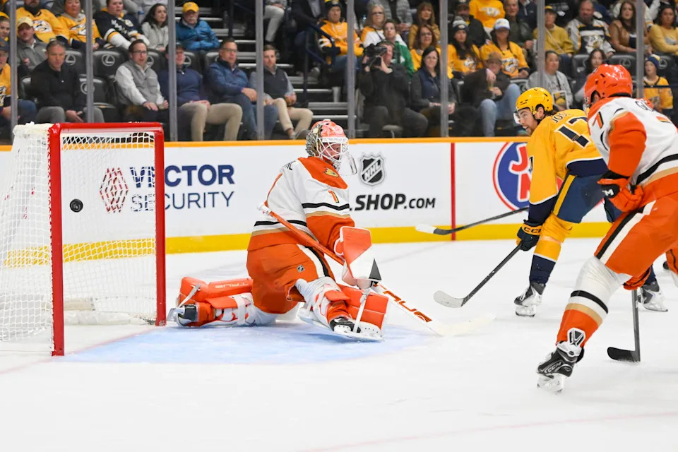Oct 21, 2025; Nashville, Tennessee, USA; Nashville Predators center Tyson Jost (17) scores past Anaheim Ducks goaltender Lukas Dostal (1) during the first period at Bridgestone Arena. Mandatory Credit: Steve Roberts-Imagn Images