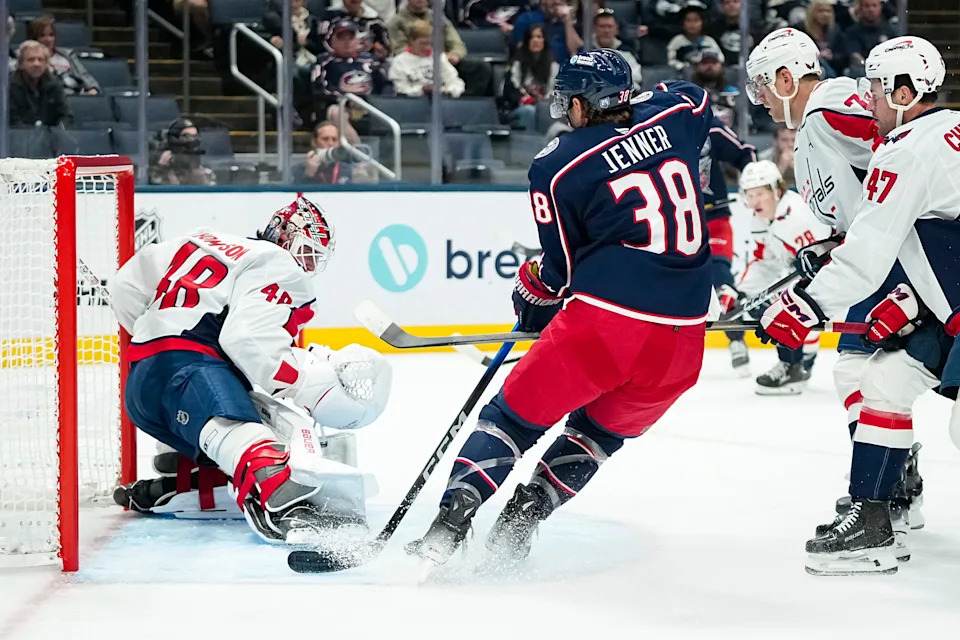 Washington Capitals goaltender Logan Thompson (48) stops a shot from Columbus Blue Jackets center Boone Jenner (38) during the first period of the NHL preseason hockey game at Nationwide Arena in Columbus on Sept. 30, 2025.