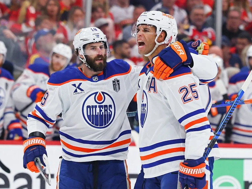  Darnell Nurse #25 and Adam Henrique #19 of the Edmonton Oilers celebrate after Nurse scored during the second period against the Florida Panthers in Game Four of the 2025 Stanley Cup Final at Amerant Bank Arena on June 12, 2025 in Sunrise, Florida.
