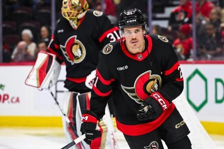 Nov 25, 2024; Ottawa, Ontario, CAN; Ottawa Senators center Nick Cousins (21) skates against the Calgary Flames during the second period at Canadian Tire Centre. Mandatory Credit: David Kirouac-Imagn Images
