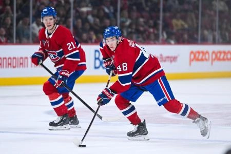 Oct 4, 2025; Montreal, Quebec, CAN; Montreal Canadiens defenseman Lane Hutson (48) plays the puck against the Ottawa Senators during the third period at Bell Centre. Mandatory Credit: David Kirouac-Imagn Images