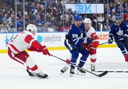Toronto Maple Leafs forward William Nylander skating through the Detroit defense.
