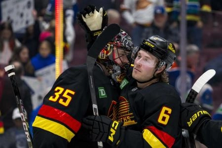 Vancouver Canucks goaltender Thatcher Demko  forward Brock Boeser.