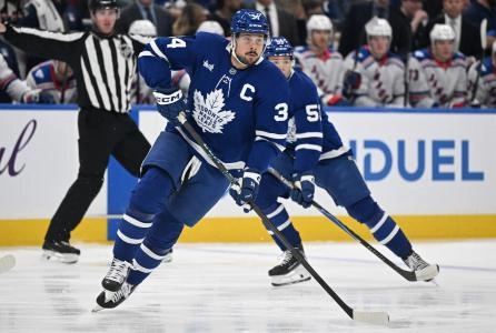 Oct 16, 2025; Toronto, Ontario, CAN; Toronto Maple Leafs forward Auston Matthews (34) skates up the ice followed by forward Easton Cowan (53) in the first period at Scotiabank Arena. Mandatory Credit: Dan Hamilton-Imagn Images