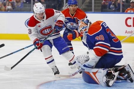 Oct 23, 2025; Edmonton, Alberta, CAN; Edmonton Oilers goaltender Calvin Pickard (30) makes a save on Montreal Canadiens forward Cole Caufield (13) during the second period at Rogers Place. Mandatory Credit: Perry Nelson-Imagn Images