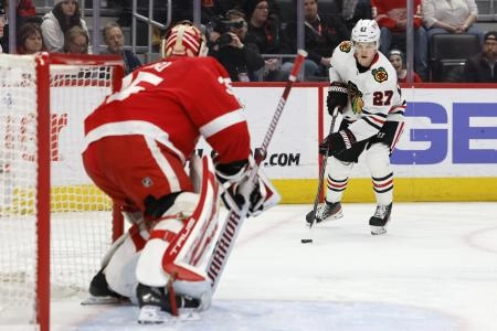 Mar 8, 2023; Detroit, Michigan, USA; Chicago Blackhawks left wing Lukas Reichel (27) skates with the puck in the first period against the Detroit Red Wings at Little Caesars Arena. Mandatory Credit: Rick Osentoski-Imagn Images