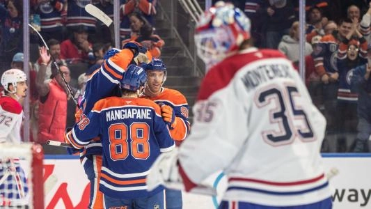 The Oilers celebrate against the Canadiens.