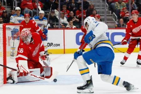 Oct 25, 2025; Detroit, Michigan, USA; Detroit Red Wings goaltender John Gibson (36) makes the save on St. Louis Blues right wing Jordan Kyrou (25) in the third period at Little Caesars Arena. Mandatory Credit: Rick Osentoski-Imagn Images