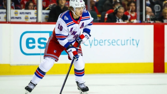Oct 26, 2025; Calgary, Alberta, CAN; New York Rangers left wing Artemi Panarin (10) controls the puck against the Calgary Flames during the second period at Scotiabank Saddledome. Mandatory Credit: Sergei Belski-Imagn Images