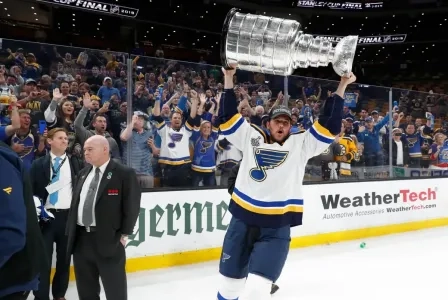 Mackenzie MacEachern hoisting the Stanley Cup with the St. Louis Blues.