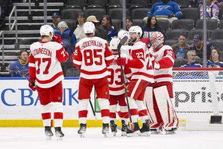 Oct 28, 2025; St. Louis, Missouri, USA; Detroit Red Wings celebrate after they defeated the St. Louis Blues at Enterprise Center. Mandatory Credit: Jeff Curry-Imagn Images
