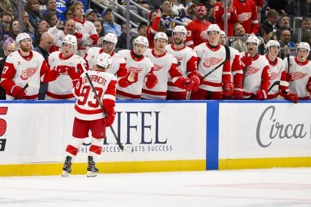 Oct 28, 2025; St. Louis, Missouri, USA; Detroit Red Wings right wing Alex Debrincat (93) is congratulated by teammates after scoring against the St. Louis Blues during the first period at Enterprise Center. Mandatory Credit: Jeff Curry-Imagn Images