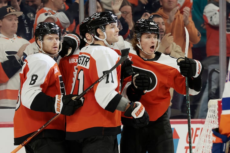 Flyers # 46 Trevor Zegras (right) celebrates tying the game at 3 in the third period of the New York Islanders at Philadelphia Flyers NHL game at Xfinity Mobile Arena in Philadelphia on Saturday, October 25, 2025.