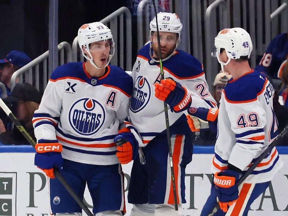  ELMONT, NEW YORK – OCTOBER 16: Ryan Nugent-Hopkins #93 of the Edmonton Oilers (l) celebrates his second period goal against the New York Islanders at UBS Arena on October 16, 2025 in Elmont, New York.