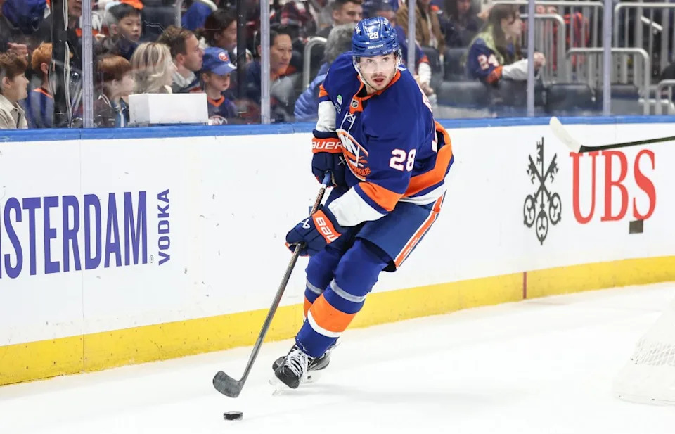Alexander Romanov, who is battling an upper-body injury, skates with the puck during the Islanders’ win over the Oilers on Oct. 16, 2025. Wendell Cruz-Imagn Images