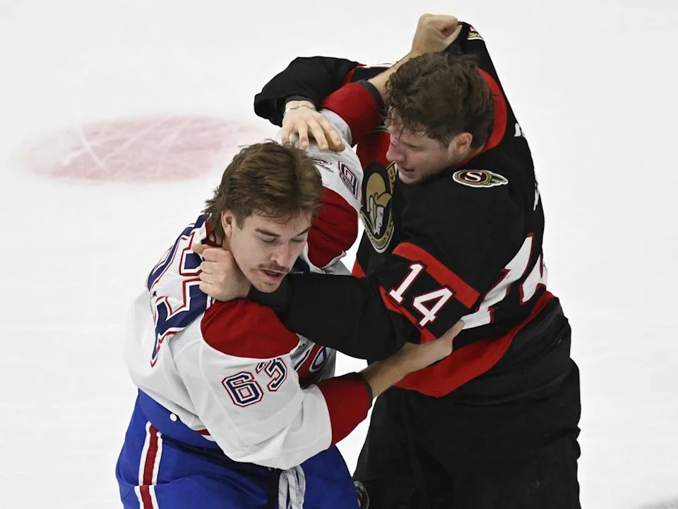  Canadiens’ Florian Xhekaj and Ottawa Senators’ Jan Jenik trade punches during first period in Quebec City on Sept. 30.