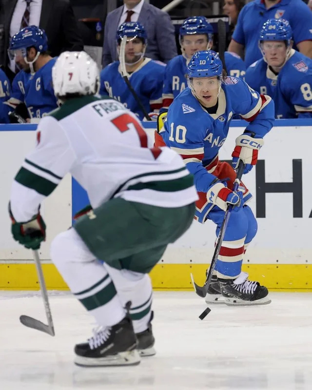Oct 20, 2025; New York, New York, USA; New York Rangers left wing Artemi Panarin (10) skates with the puck against Minnesota Wild defenseman Brock Faber (7) during the second period at Madison Square Garden.Credit&colon; Brad Penner-Imagn Images