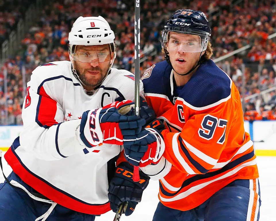 Edmonton Oilers forward Connor McDavid (97) and Washington Capitals forward Alex Ovechkin (8) battle for position during the second period at Rogers Place.Perry Nelson-Imagn Images