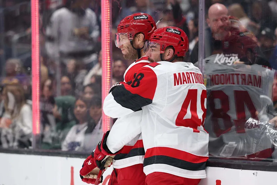 Jordan Staal (11) and Jordan Martinook (48) of the Carolina Hurricanes celebrate one of Staal’s two goals in a 4-3 win over the Los Angeles Kings on Sunday.