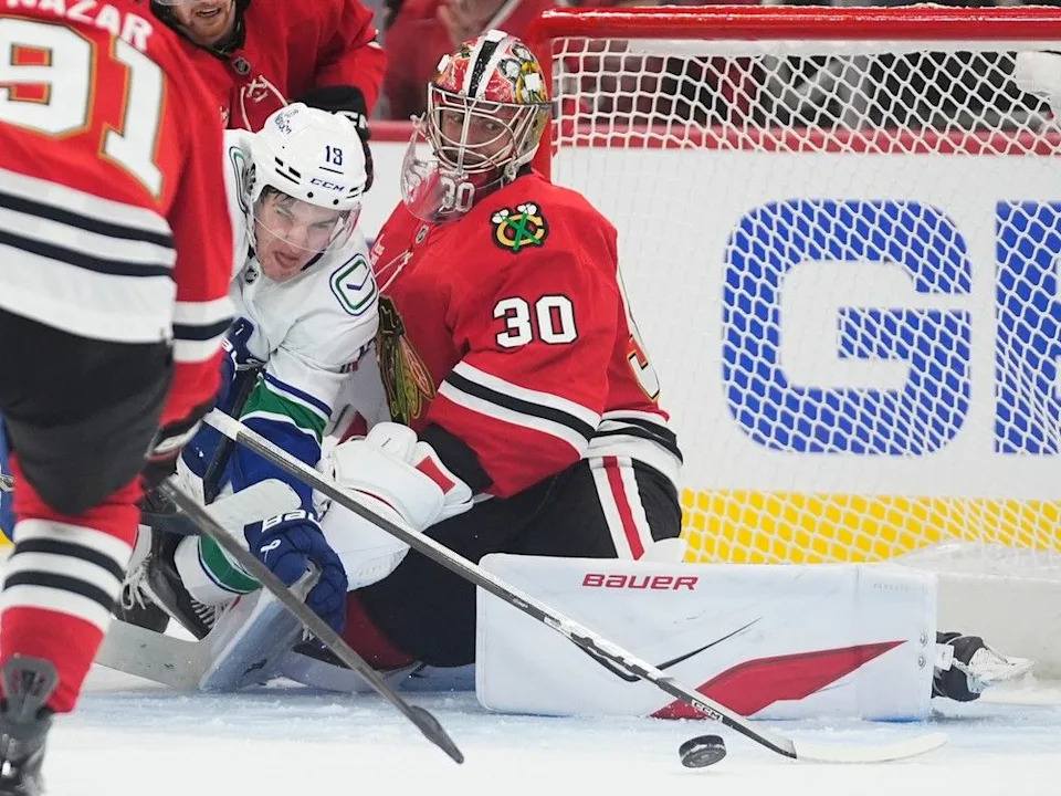  Chicago Blackhawks goaltender Spencer Knight makes a save against Vancouver Canucks Drew O’Connor Friday.