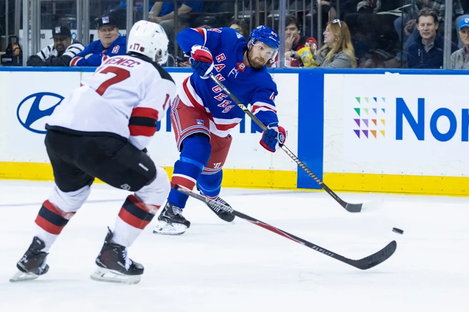New York Rangers defenseman Vladislav Gavrikov (44) shoots around New Jersey Devils defenseman Simon Nemec (17) in the first period at Madison Square Garden, Thursday, Oct. 2, 2025, in New York, NY. Corey Sipkin for the NY POST