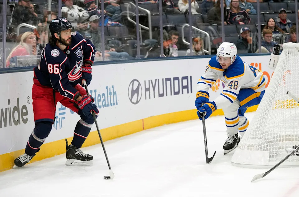 Columbus Blue Jackets right wing Kirill Marchenko (86) looks to pass the puck against Buffalo Sabres center Tyson Kozak (48) during the third period of their preseason game at Nationwide Arena on Sept. 22, 2025.
